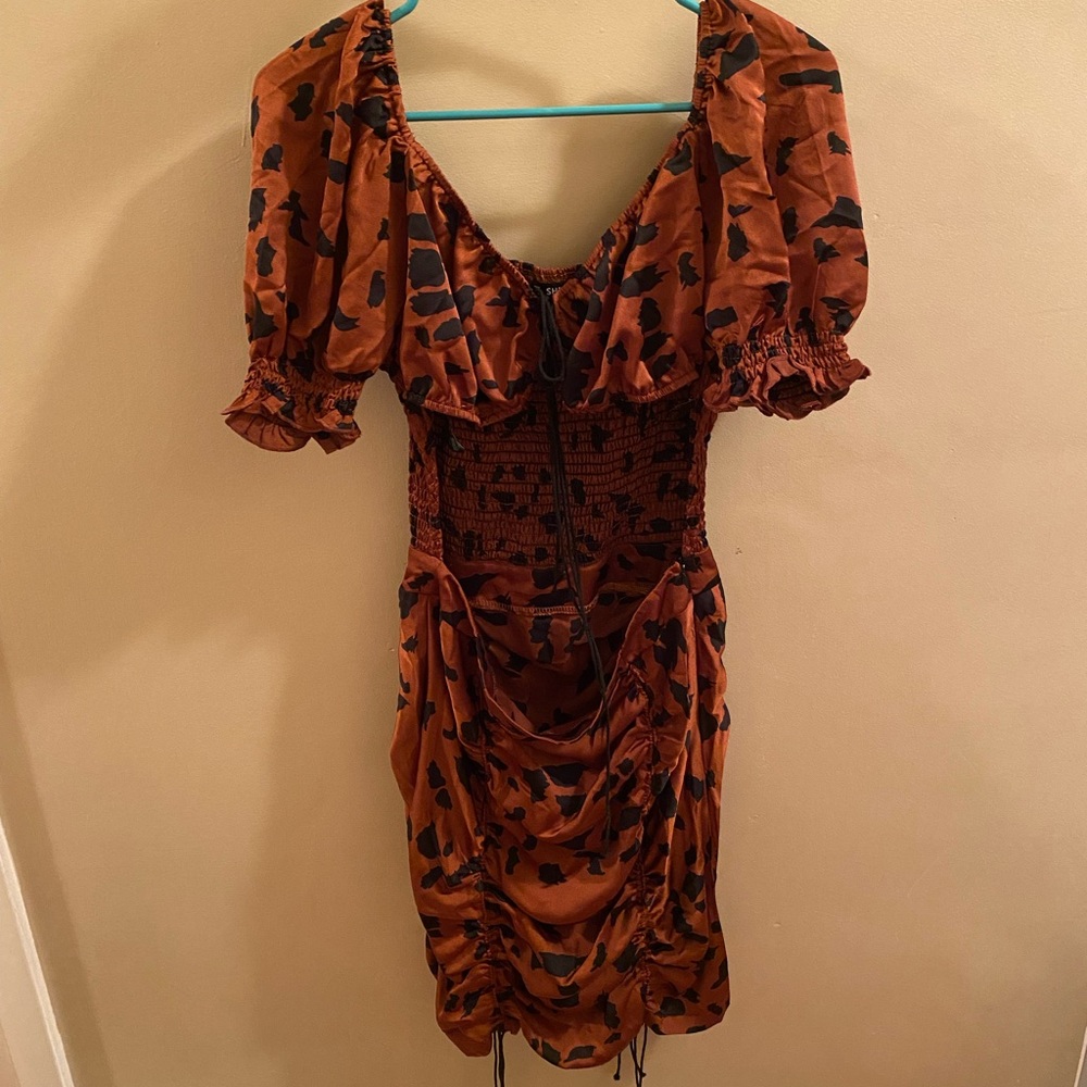 NEVER WORN open in the stomach area
